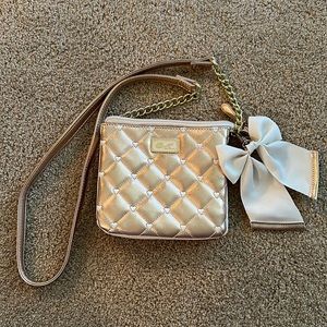 Adorable Betsey Johnson purse. Rose gold with cream bow. Excellent condition.